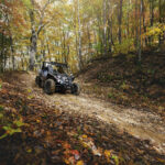An ATV rides through the mountains on the Hatfield McCoy Pocahontas ATV trail in the fall.