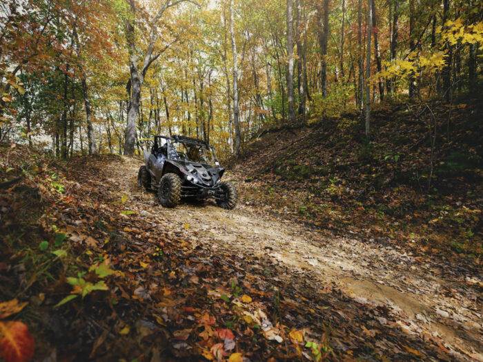 An ATV rides through the mountains on the Hatfield McCoy Pocahontas ATV trail in the fall.