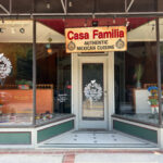 Casa Familia storefront in Bramwell, with large display windows, decorative figures, and a sign reading 'Authentic Mexican Cuisine'
